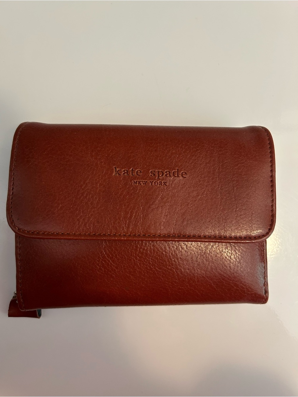 kate spade embossed leather wallet in deep brown